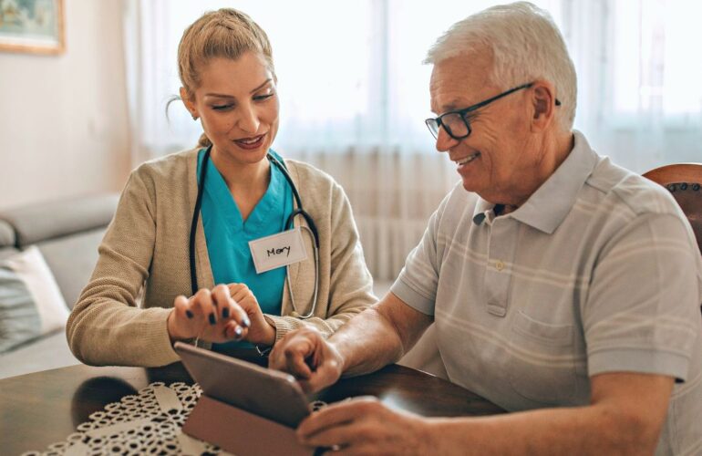 Woman showing guy an ipad with health info